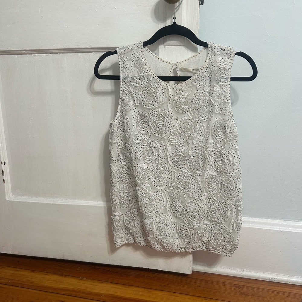 Elegant White & Black Sleeveless Top with Ruffled Floral Pattern
